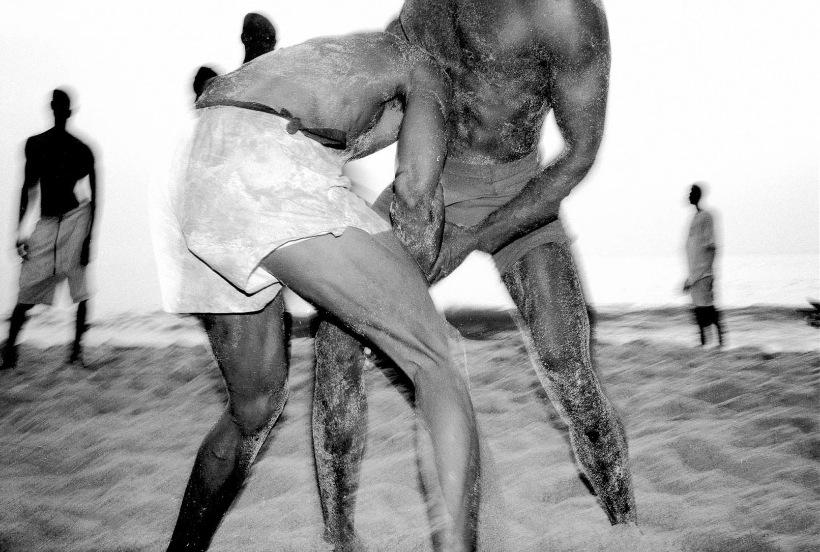 Two Senegalese wrestlers from Écurie de Fans practicing on plage de Fann.